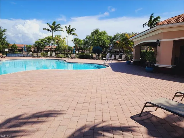 View of pool with a clubhouse