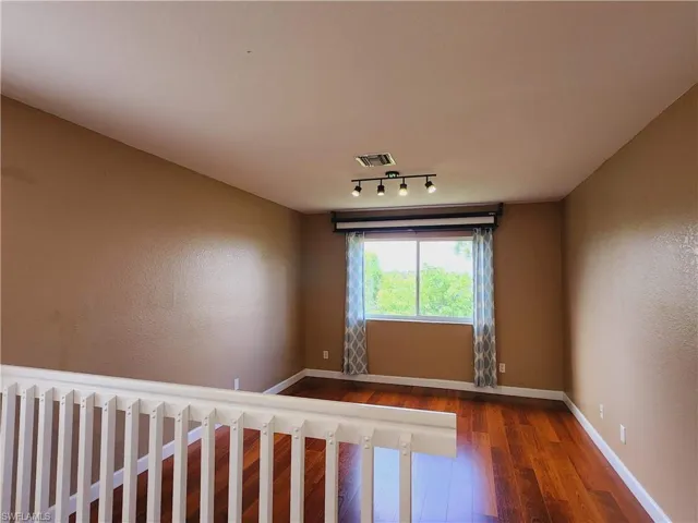 Second floors has a loft with hardwood/wood-style floors