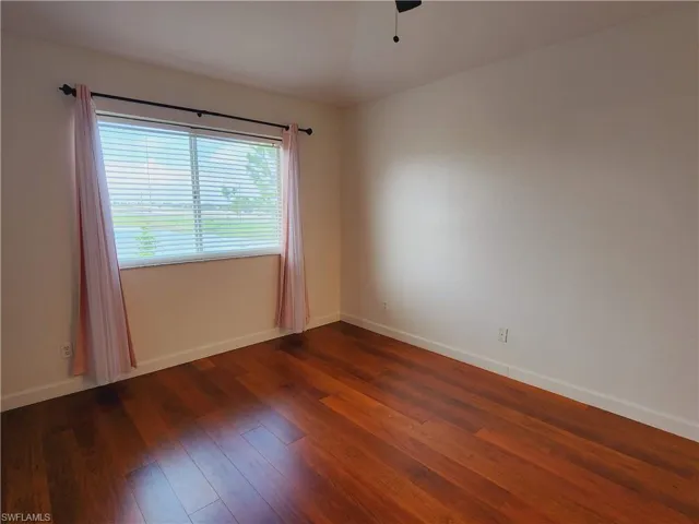 Master bedroom featuring hardwood / wood-style flooring