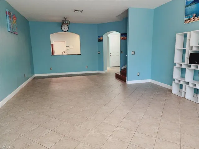 Unfurnished living room with serving window