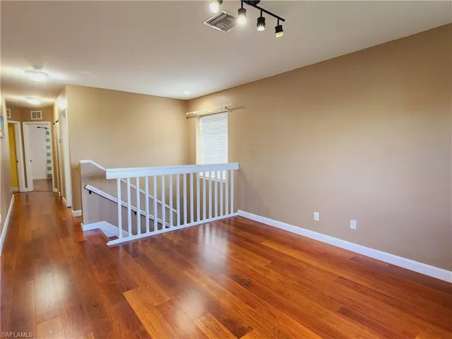 Loft featuring hardwood / wood-style floors