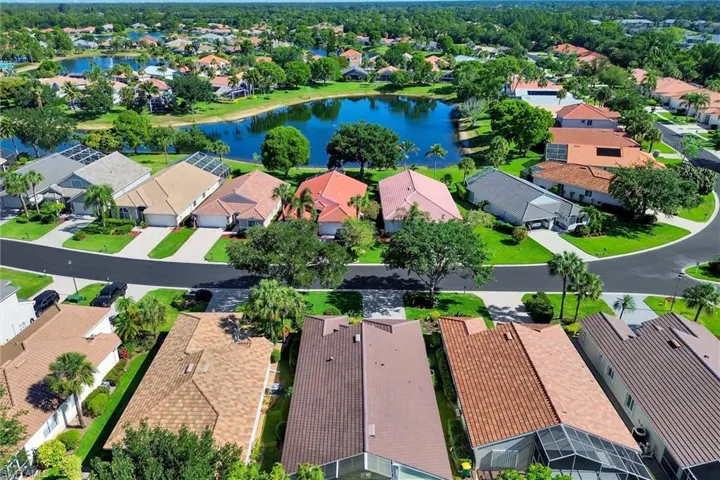Residential neighborhood featuring a prominent central lake