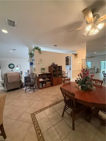 The property features tile flooring throughout, a ceiling fan with integrated lighting, and recessed lighting