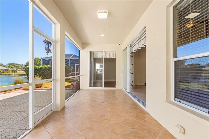 Unfurnished sunroom with a water view