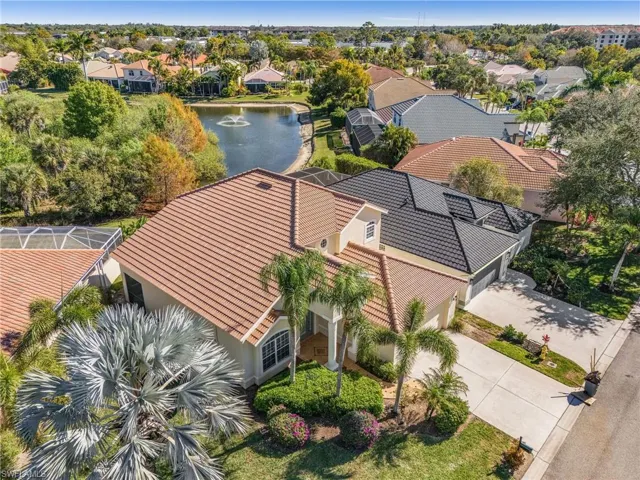 Aerial perspective of suburban area featuring a large body of water