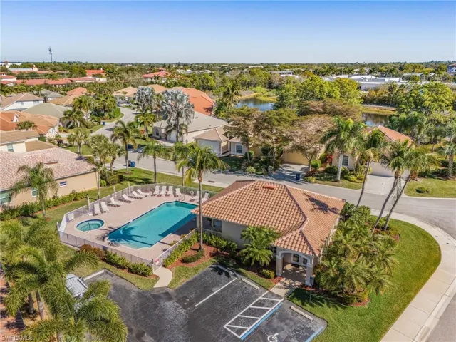 Aerial perspective of suburban area featuring a pool area