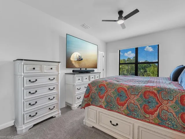 Primary bedroom w/ gorgeous lake views