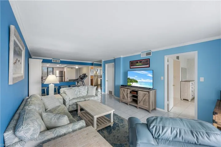 Tiled living room with crown molding
