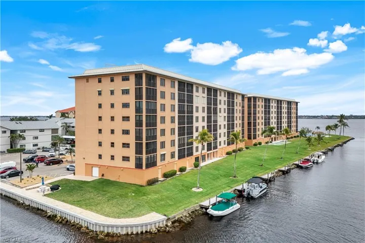 View of apartment building / complex with a water view