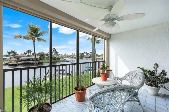 Sunroom with a water view
