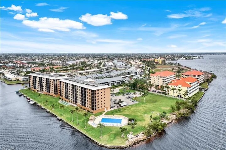 Bird's eye view of a large body of water and apartment complex / building