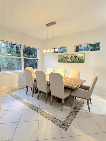 Beautiful dining room looking out to lunch landscaping in back yard.
