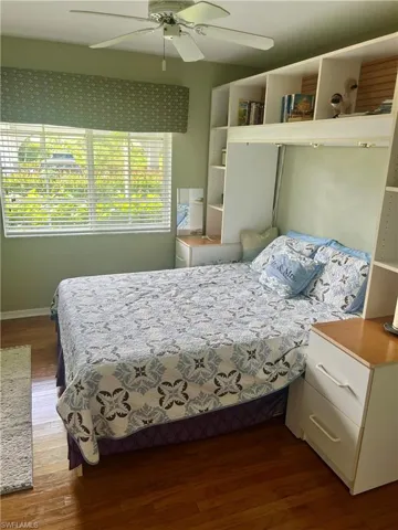 Bedroom featuring hardwood / wood-style flooring and ceiling fan