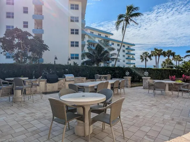 View of patio with area for grilling and exterior kitchen