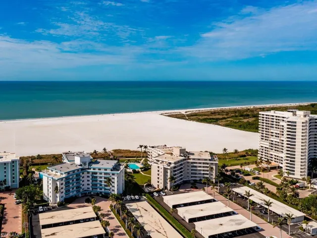 Aerial view with a water view and a beach view