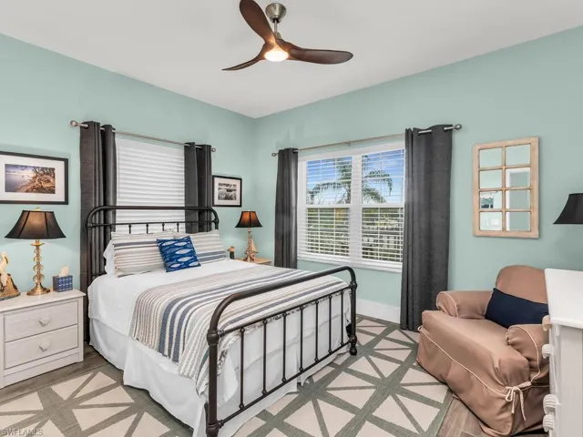 Bedroom featuring ceiling fan and light wood-type flooring