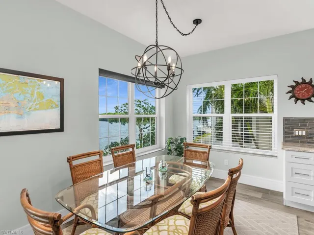 Dining area featuring a chandelier, light hardwood / wood-style flooring, and a healthy amount of sunlight