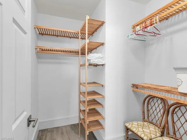 Walk in closet featuring wood-type flooring
