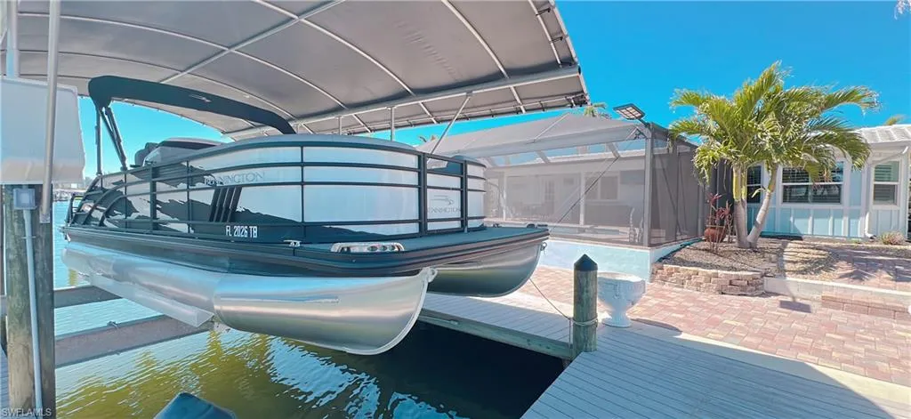 View of dock with a lanai