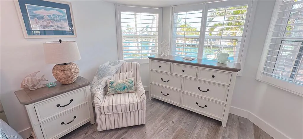 Sitting room featuring baseboards and light wood finished floors