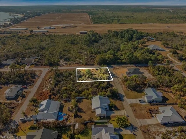 Aerial view of property's location with property boundaries highlighted and nearby suburban area