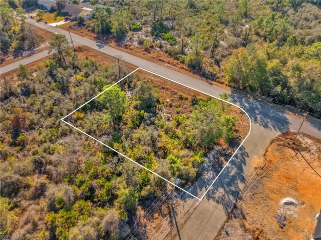 Aerial overview of property's location with property parcel outlined