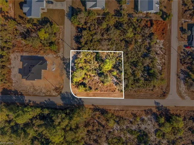 Aerial overview of property's location featuring property parcel outlined