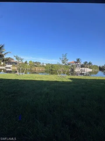 View of yard with a water view and plenty room for a pool