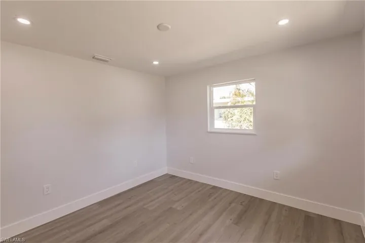 Spare room featuring hardwood / wood-style floors