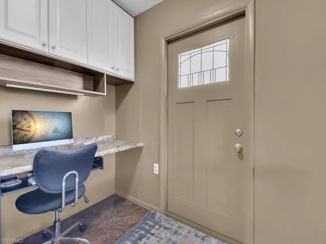 Office space with built in study area and baseboards