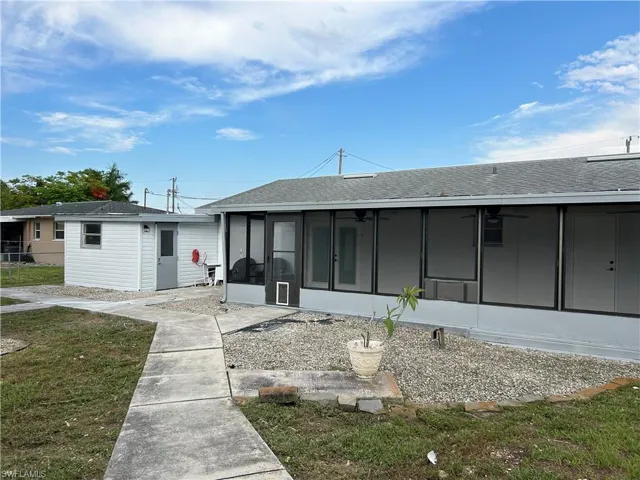 Back of house featuring a sunroom