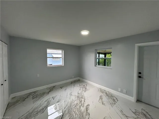 Unfurnished room with tile flooring