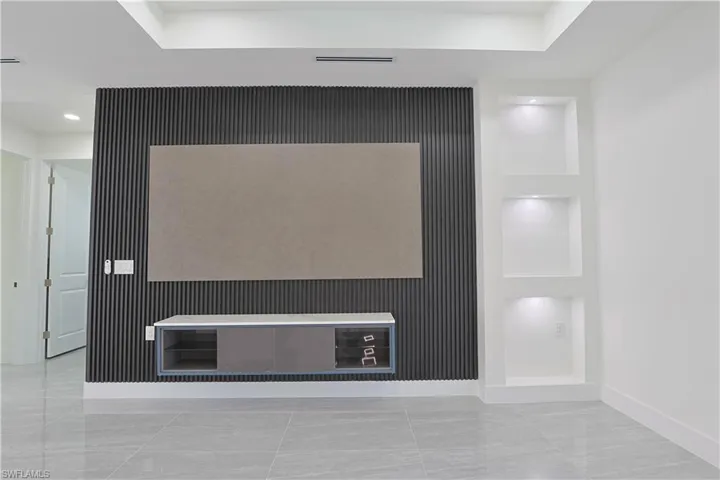 Detailed view of built in shelves and recessed lighting