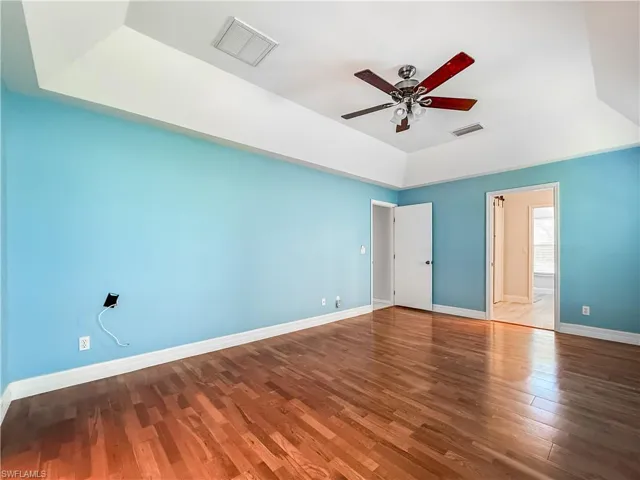 Unfurnished bedroom with wood finished floors and ceiling fan