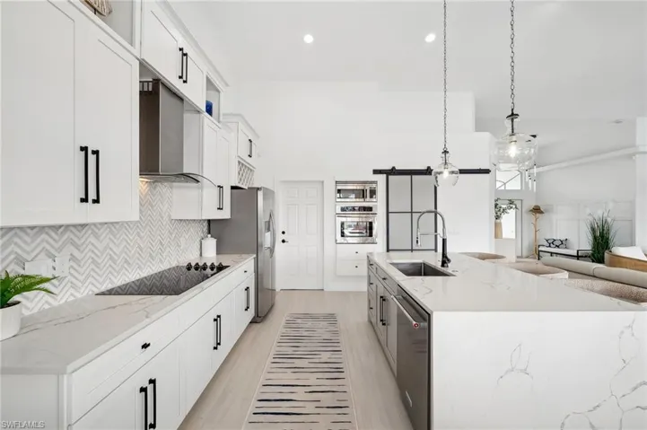 Stainless appliances and new backsplash in the kitchen