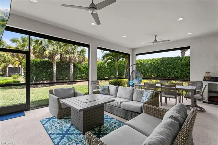 Sunroom / solarium with an outdoor living space, ceiling fan, and outdoor dining space