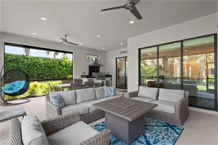 Living room featuring plenty of natural light, ceiling fan, and recessed lighting