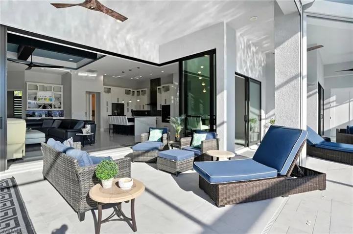 View of patio / terrace featuring an outdoor hangout area and ceiling fan