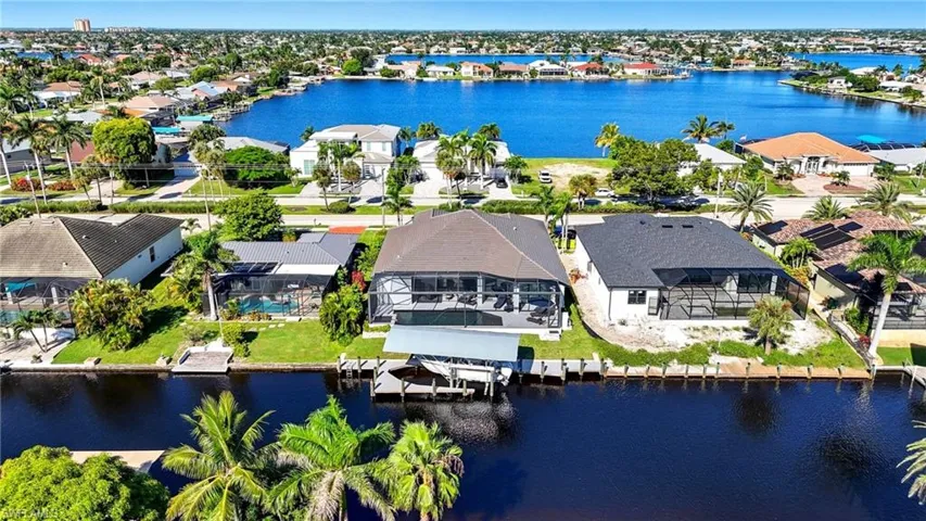 Aerial perspective of suburban area with a nearby body of water