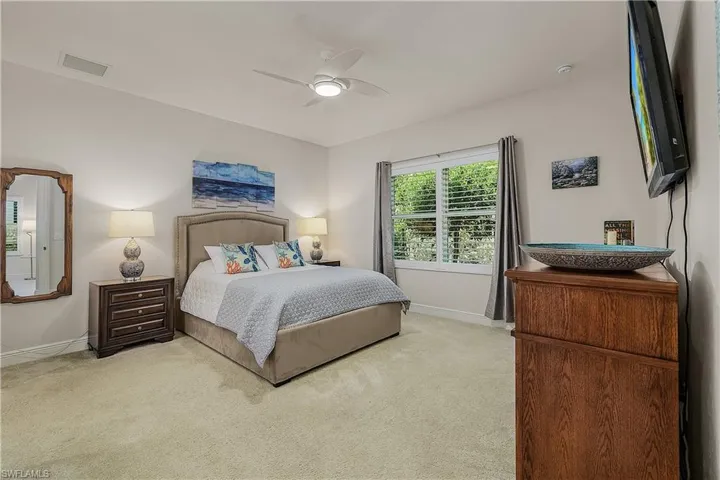 Bedroom featuring carpet and ceiling fan