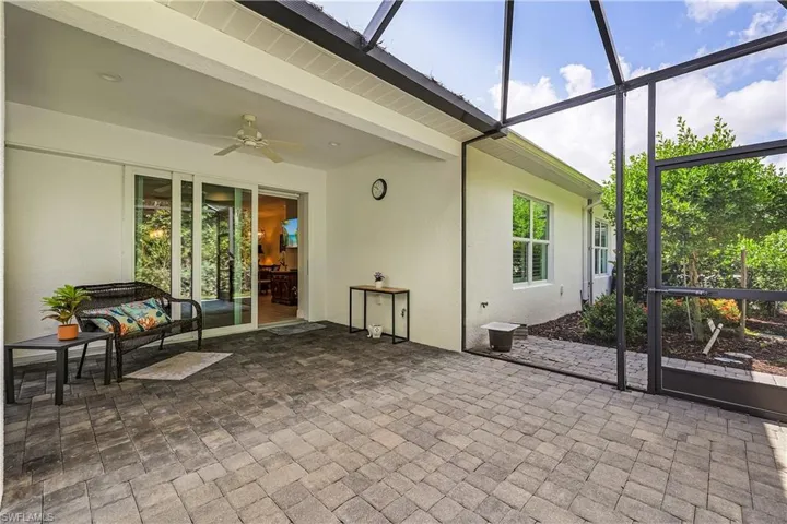 Sunroom featuring ceiling fan