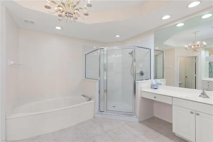 Primary Bathroom with Separate Shower & Very Large Soaker Tub. Tray Raised Ceiling