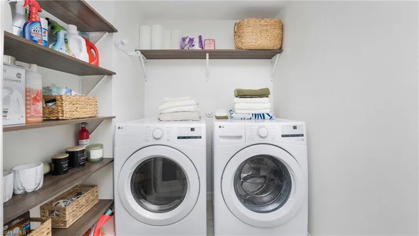 Large laundry room with storage