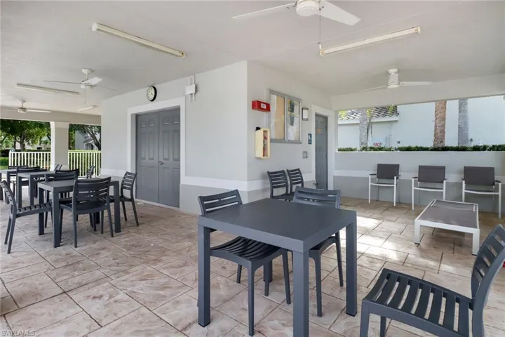 Amenity Center dining area with ceiling fan and light tile patterned floors