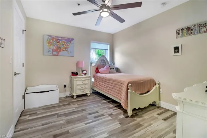 Bedroom featuring light hardwood / wood-style flooring and ceiling fan