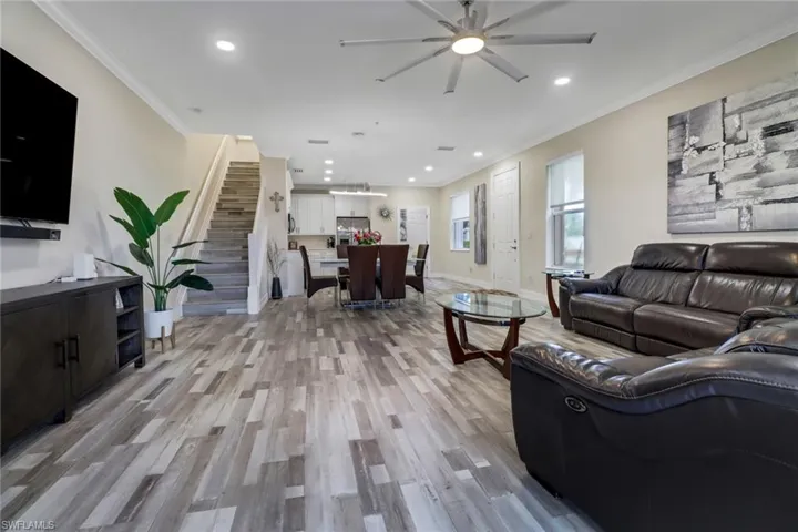 Open concept Great Room and staircase leading to second floor bedrooms