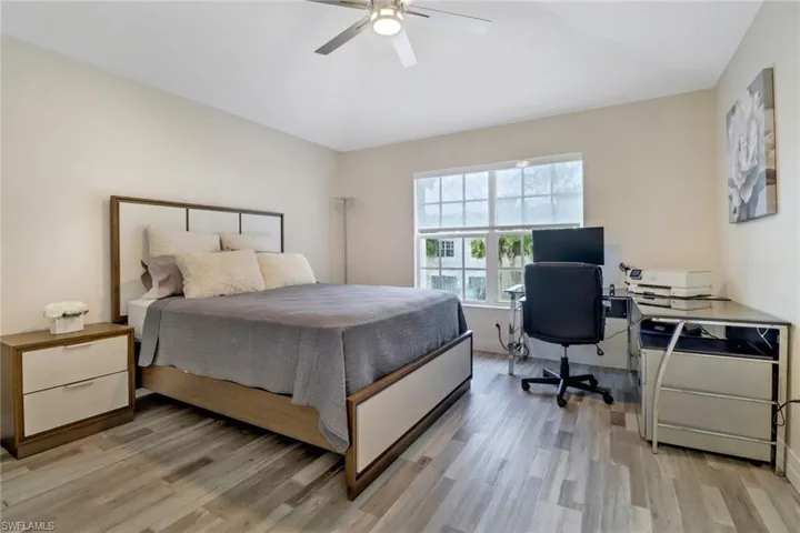 Bedroom featuring light hardwood / wood-style flooring and ceiling fan