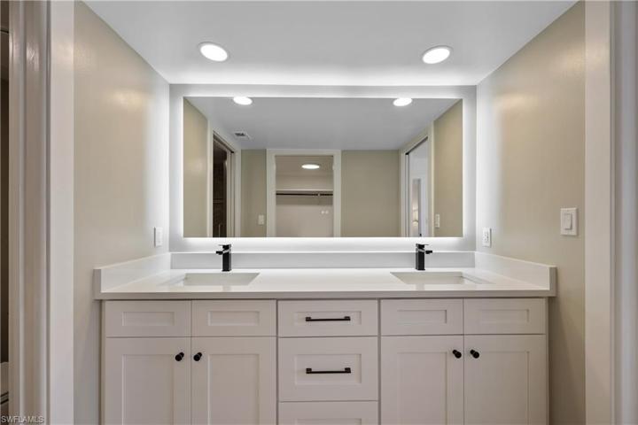 Primary bath, new vanity, Quartz countertop, new faucets/plumbing, new electrical outlets/switches and heated backlit mirror