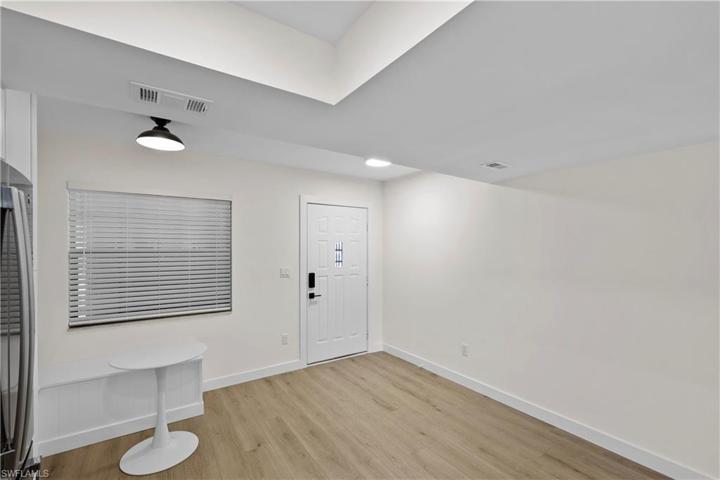 Entry door and custom built in breakfast seating area