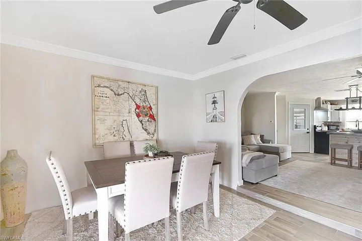 Dining area featuring ornamental molding